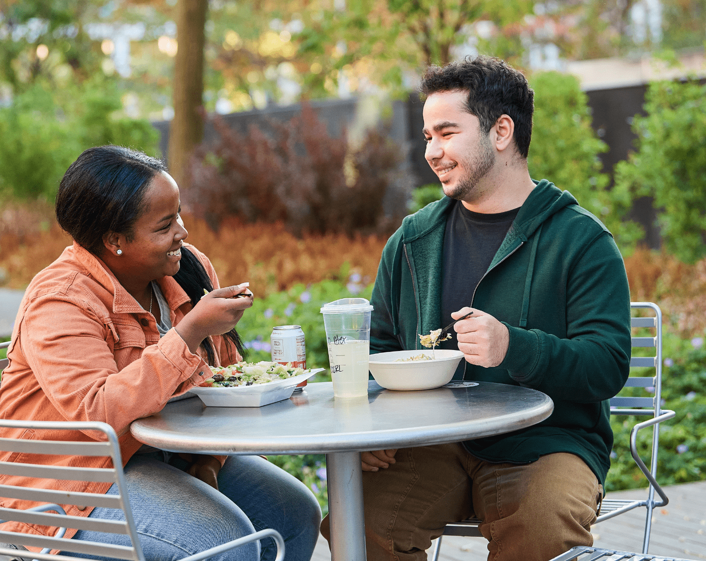 Students sitting at a table enjoying a meal. 